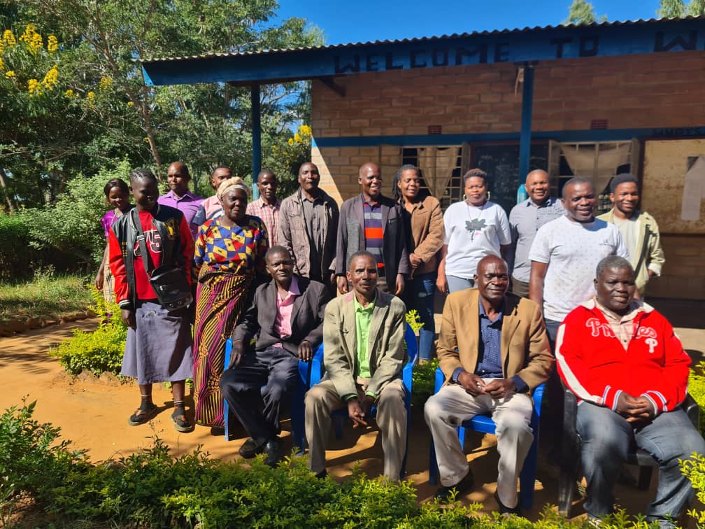 Group photo with chiefs and members of KEYS and community after awareness campaign.